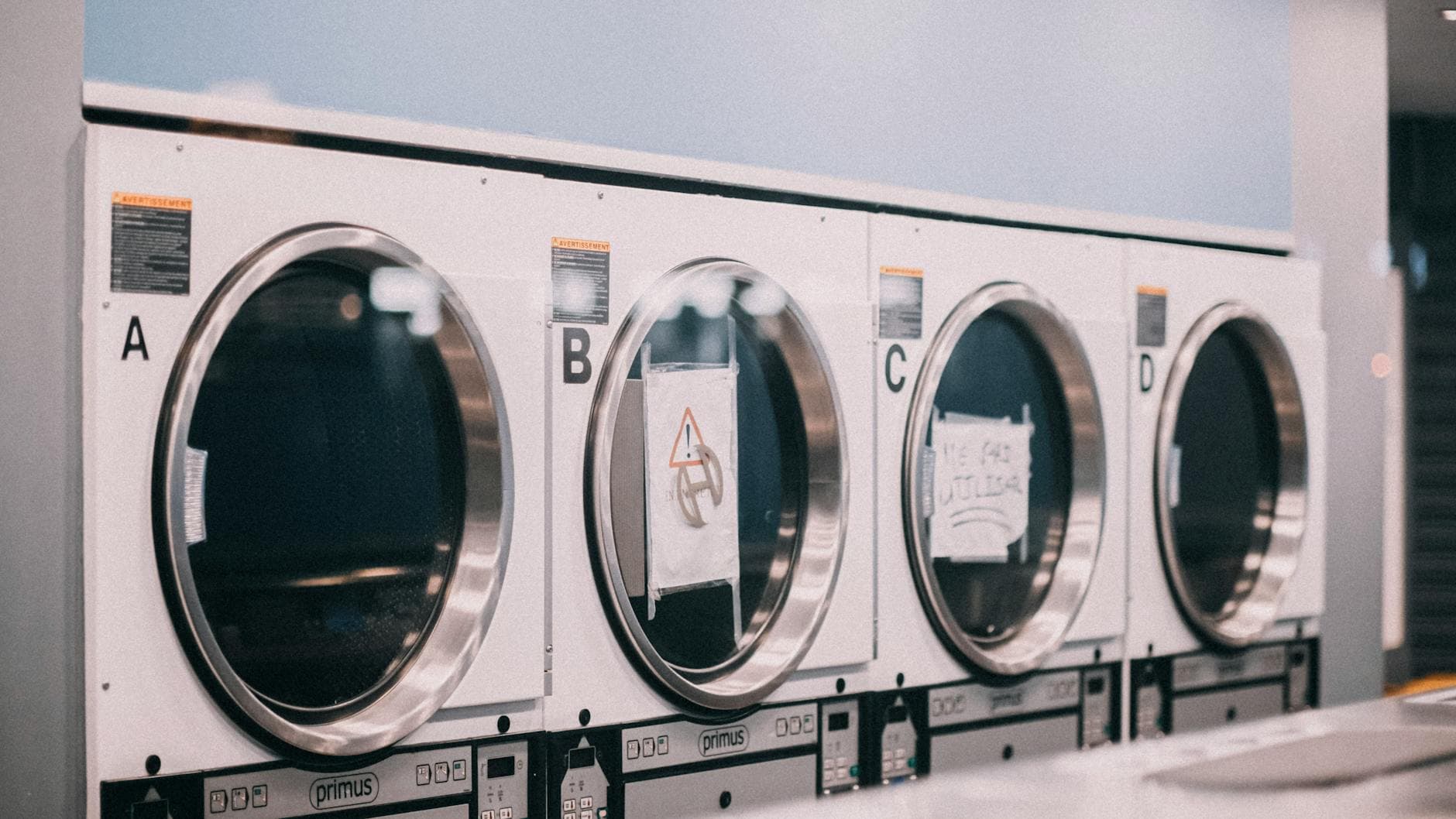 Bright clean laundromat with washing machines
